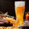 Das Boot beer mug with Bavarian sausages and fries during Oktoberfest.