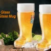 Das beer boot glass mugs side by side on table full of beer.