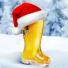 A Santa hat on a Das Boot glass beer mug in a snow setting.