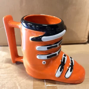 ceramic ski boot mug, orange with white buckles and holds 14oz.